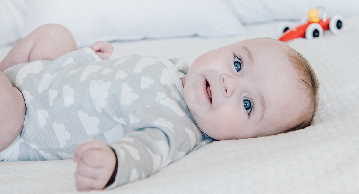 Banner baby on bed